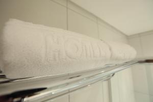 a white refrigerator freezer with the word mom on it at Gales Park Hotel in Dourados