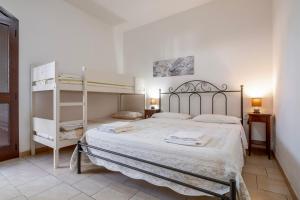 a bedroom with a bunk bed and a ladder at Agriturismo Col Moschin in Grosseto