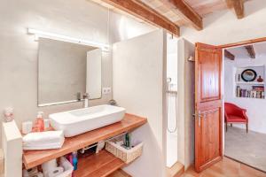 a bathroom with a sink and a mirror at Can Sans in Banyalbufar