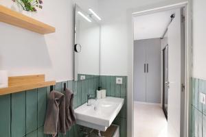a bathroom with a sink and a mirror at Dreaming Penthouse Mogan in Mogán +16 photos