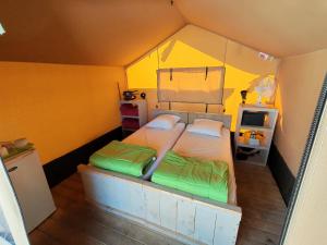 an overhead view of a bedroom with a large bed at Camping les Lavandes, Castellane in Castellane