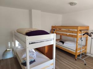 a room with two bunk beds in a room at Fair-Hostel in Darmstadt