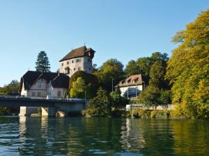 a castle sitting on top of a bridge over a river at Ferienwohnungen Haus Birgit in Günzgen