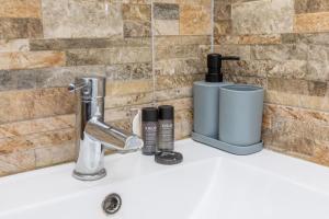 a bathroom sink with two products on it at Azur et Lavande proche plage in Fréjus +17 photos