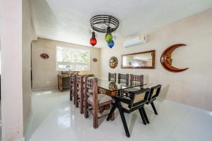 a dining room with a table and chairs at Oceanfront home with beach access pool balconies & waterfront hammocks - Villa Sol in Tulum +30 photos