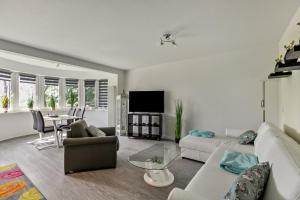 a living room with a couch and a table at Föhr in Galmsbüll