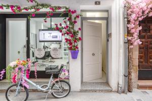 a bike parked in front of a store with flowers at Cozy Apartment Blanes in Blanes