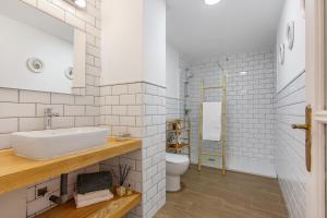 a bathroom with a sink and a toilet at Atlantic Nomad Retreat in Puerto del Rosario +17 photos