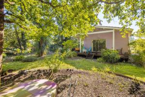a home with a yard with a house at Joli Petit Chalet La Cote d'Argent in Le Porge