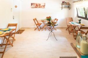 a dining room with wooden chairs and tables and a table and chairsktop at Lyon Mon Amour Bed and Breakfast in Lyon