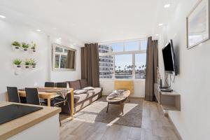 a living room with a couch and a table at Los Molinos 202 in Maspalomas