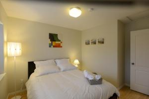 Ένα ή περισσότερα κρεβάτια σε δωμάτιο στο Marpole Guest House