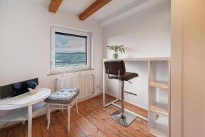 a home office with a desk and a chair at Fewo im Rosenberg mit Dachterasse in Lahnstein