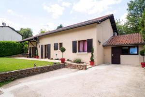 a house with a driveway in front of it at Lyon Mon Amour Bed and Breakfast in Lyon