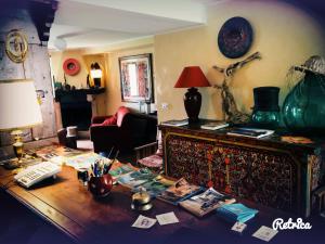 a cluttered living room with a table with papers on it at Il Peschio in Pescocostanzo