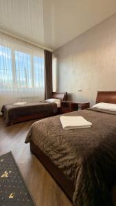 a hotel room with two beds in a room at Відпочинковий - комплекс '"Замок Лева"" in Peremyshlyany