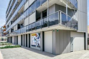 an external view of a building with a balcony at Murtra Apartment in Roses