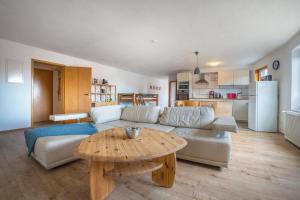 a living room with a couch and a table at Ferienwohnung Knopf in Hardegsen