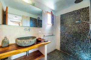 a bathroom with a vessel sink on a wooden counter at Sa Paret Nova in Sant Francesc Xavier +22 photos