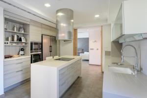 a kitchen with a white counter and a sink at Mediterranean Beach in Arenales del Sol