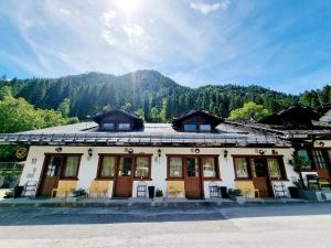 a building with a mountain in the background at Appartamento Adamello 12 in Pinzolo