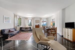 a living room with a couch and a table at Alta Via Ligure - La Squazza in Bertigaro