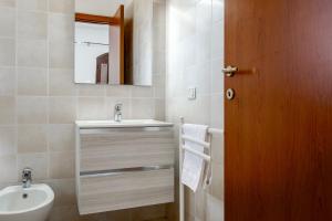 a bathroom with a sink and a mirror at Agriturismo Col Moschin in Grosseto