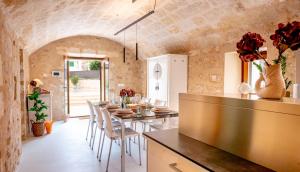 a dining room with a long table and chairs at Moli De Can Cristan in Muro