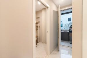 a hallway with a door leading into a room at Ginex Luxury Suite, Trani in Trani +20 photos