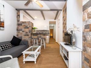 a living room with a couch and a table at Casa Jimena in Vejer de la Frontera
