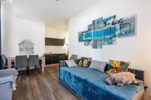 a living room with a couch with a dog laying on it at murihaus Ferienwohnung 2 in Aue