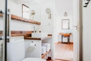 a bathroom with a sink and a toilet at Casa Rural Kiko 2 in Icod de los Vinos +26 photos