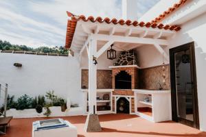 a patio of a house with a fireplace at Casa Rural Kiko 2 in Icod de los Vinos