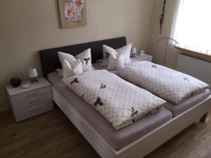 a bedroom with two beds with pillows on it at Ferienhaus Wiese in Olsberg