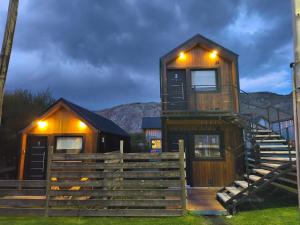 a wooden house with lights on top of it at Patagonia Tiny house 3 in El Chalten