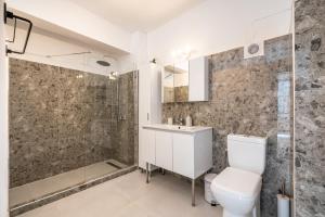 a bathroom with a shower and a toilet and a sink at Katia's Home in Rhodes Town +50 photos