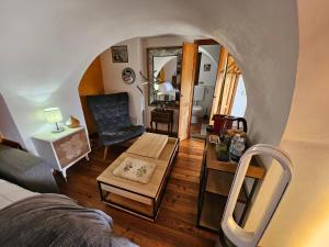 an overhead view of a living room with a couch and a table at La Torre Medievale in Triora