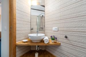 a bathroom with a sink and a mirror at Rosa in Vejer de la Frontera +17 photos