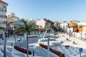 a view of a city with a playground at Capricho Torre del mar in Torre del Mar