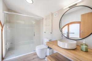 a bathroom with a sink and a mirror at El Molí de Can Feliu in Navés