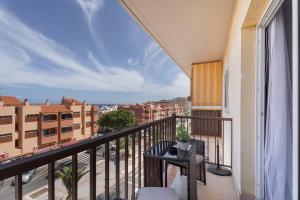 a balcony with a view of a city at Apartamento Gabriela in Candelaria