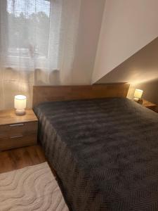 a bedroom with a large bed and a window at Modern Apartment in Bebra