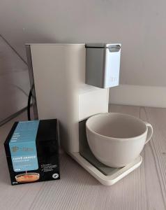 a white bowl on a scale with a box at Modern Apartment in Bebra