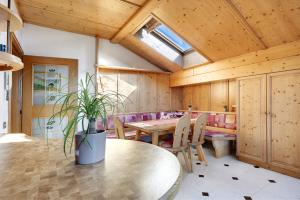 a dining room with a table and chairs at Apartment Holzsuite in Fondo +28 photos