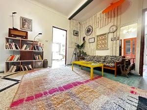 a living room with a couch and a table at Salty in Essaouira