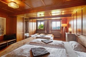 a room with three beds and a window at Black Forest Woods in Bernau im Schwarzwald
