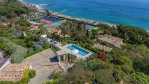 an aerial view of a house with a swimming pool at Ventaou in Sainte-Maxime