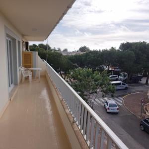 a balcony with a view of a parking lot at Apartamento Portosun Caracol in Portocolom +4 photos