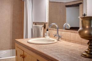 a bathroom with a sink and a bath tub at Casa Antonia in Sóller +16 photos