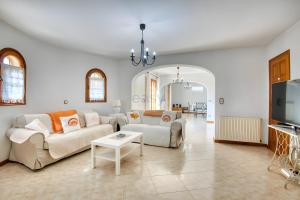 a living room with a couch and a table at Villa Speranza by Easy Brava in Calonge
